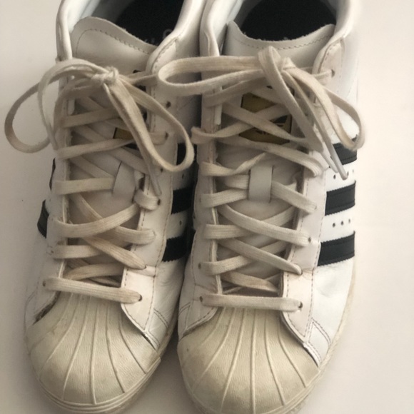 all black high top shell toe adidas